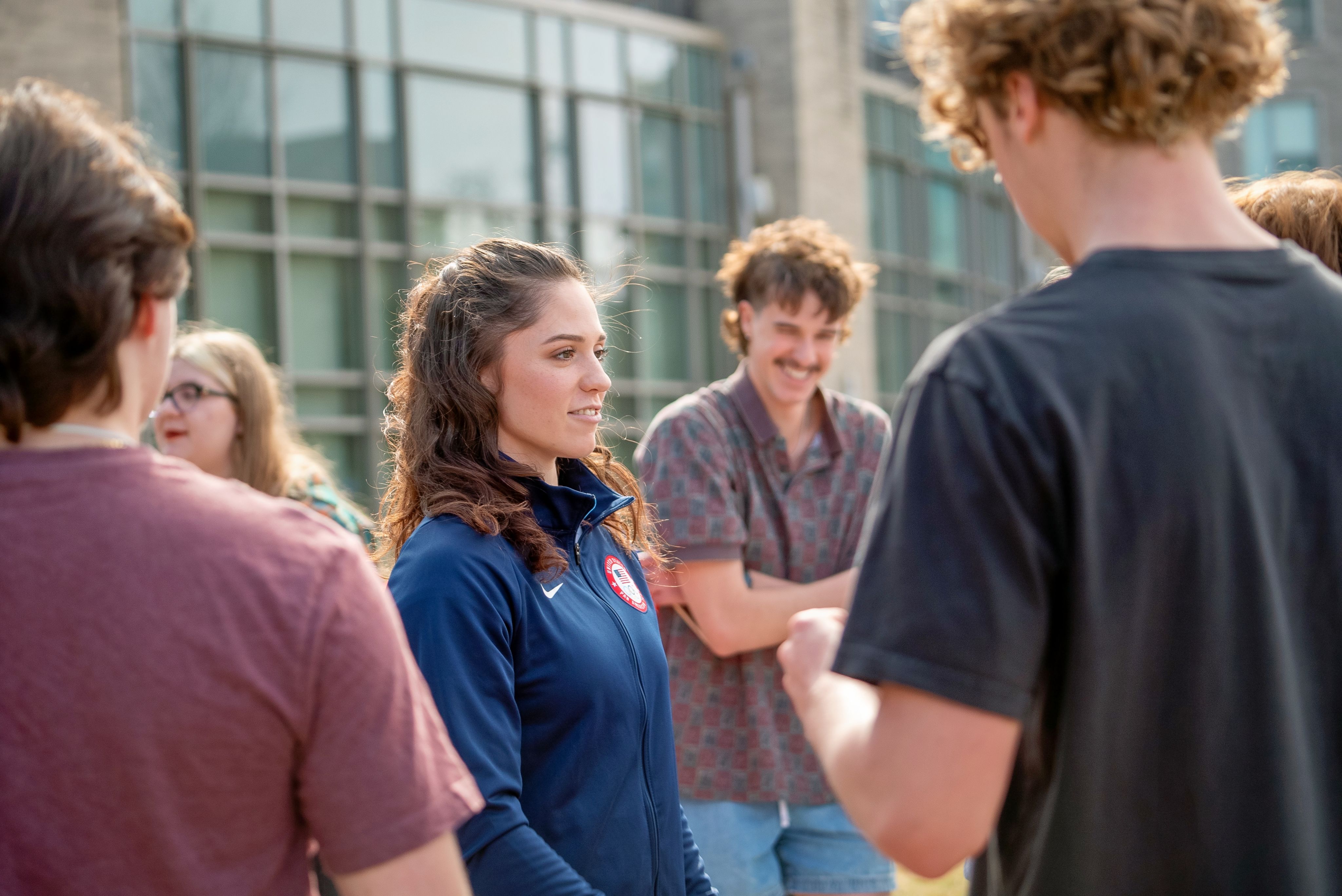 Kelly Piper talking with Xavier students on the Yard